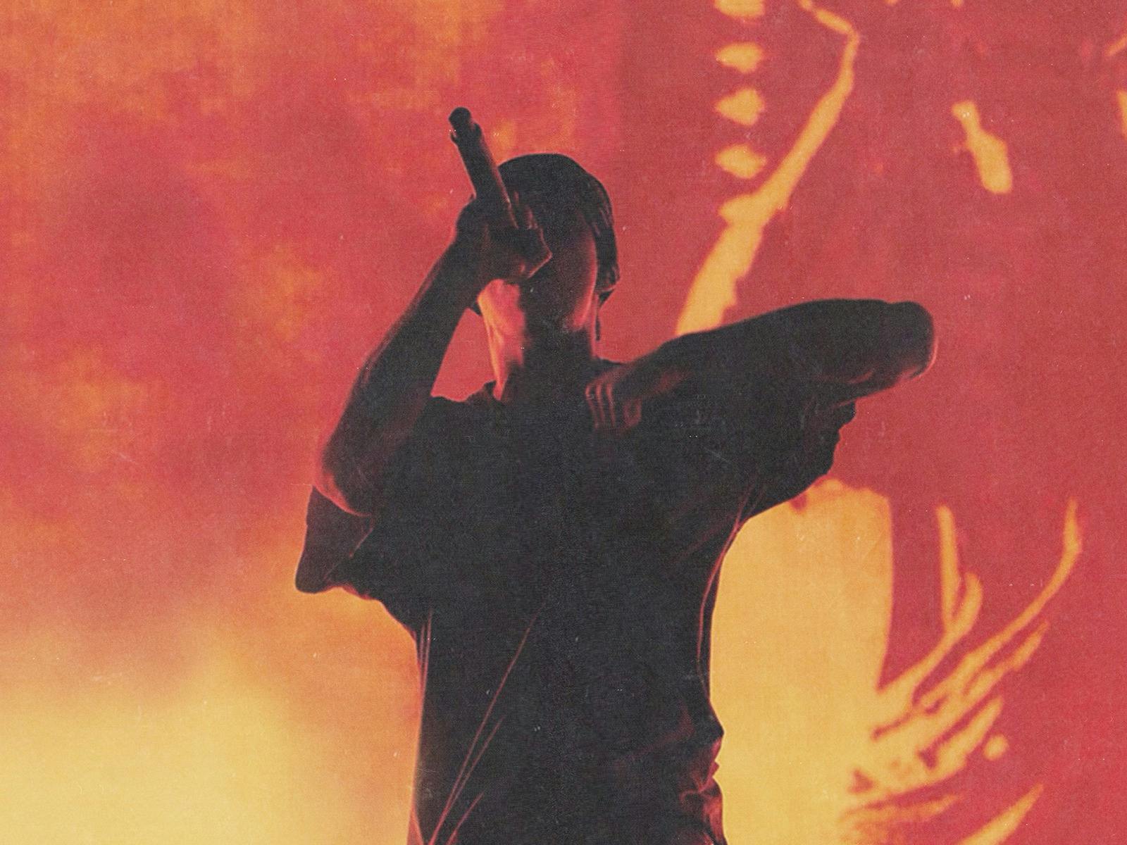 The Kid Laroi holding microphone on stage