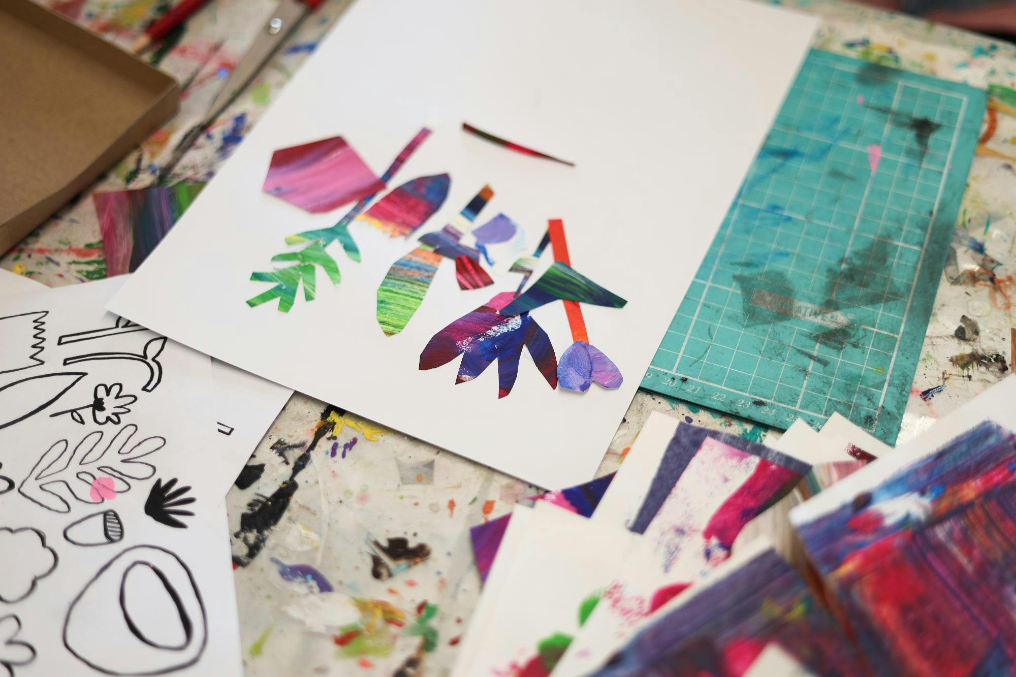 Colourful collage flowers on white paper
