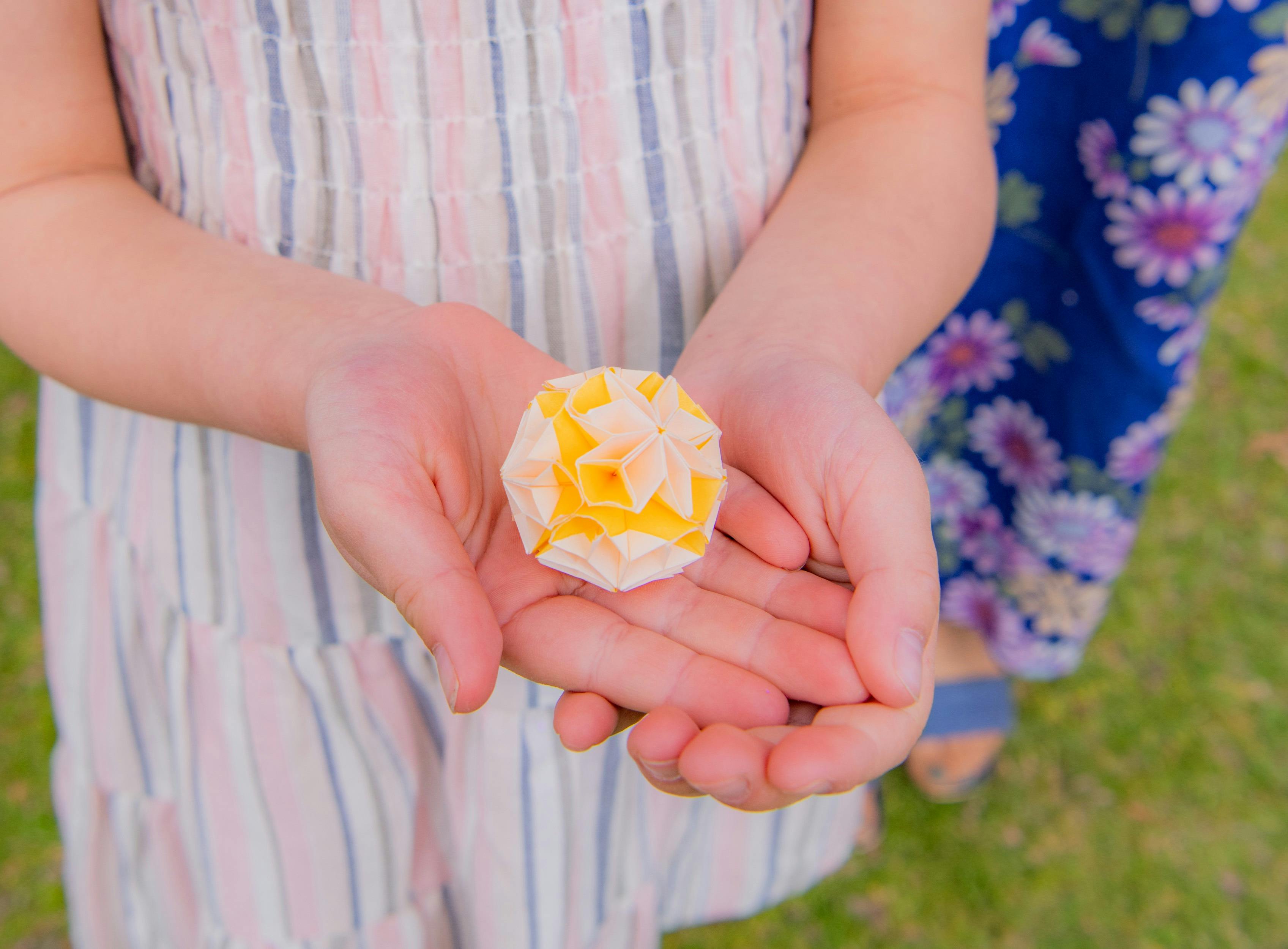 two hands holding a tea sweet