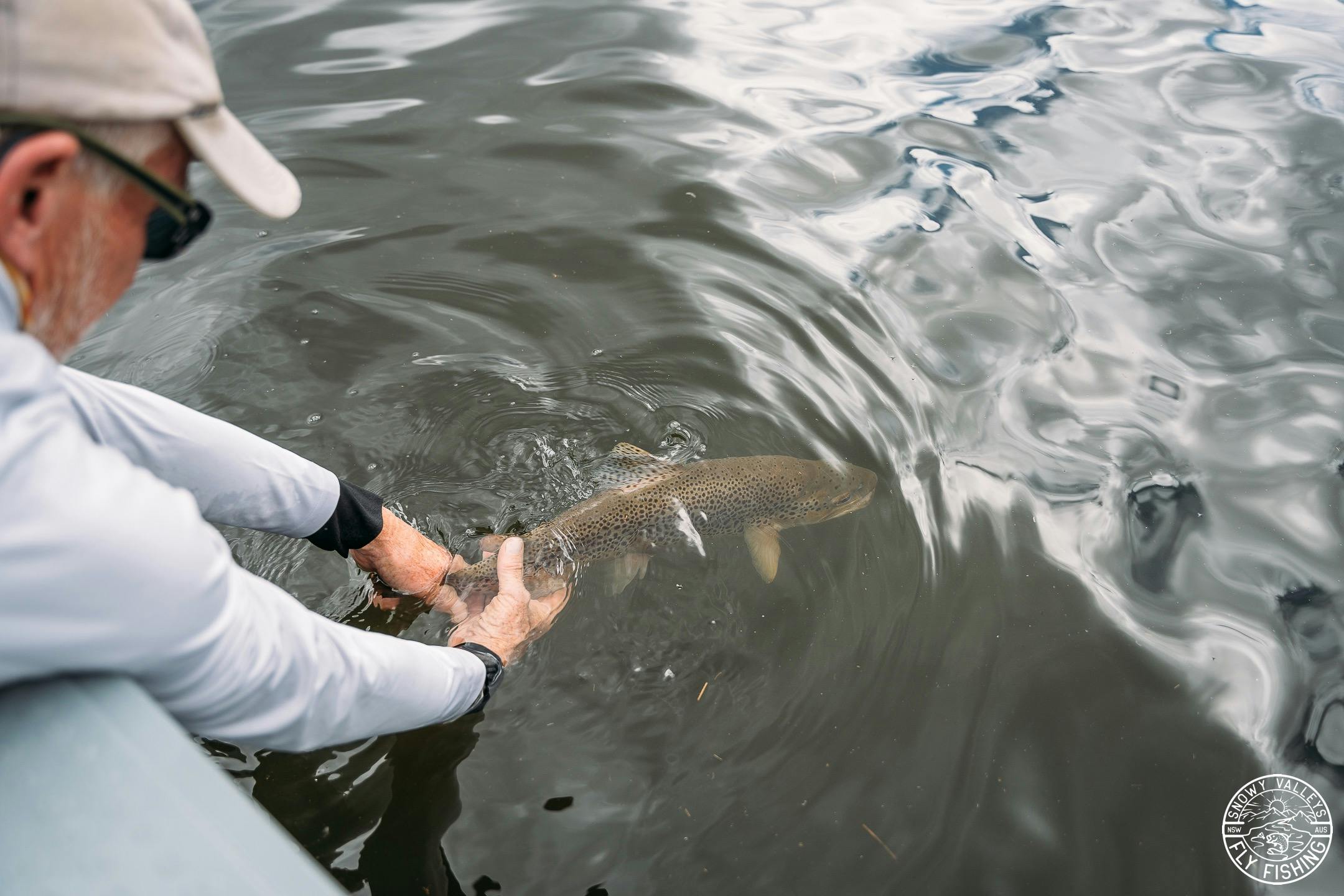 Here Kerry releases a beautiful brown trout caught fly fishing in Lake Eucumbene