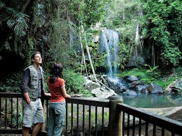 Couple of viewing deck at base of falls.