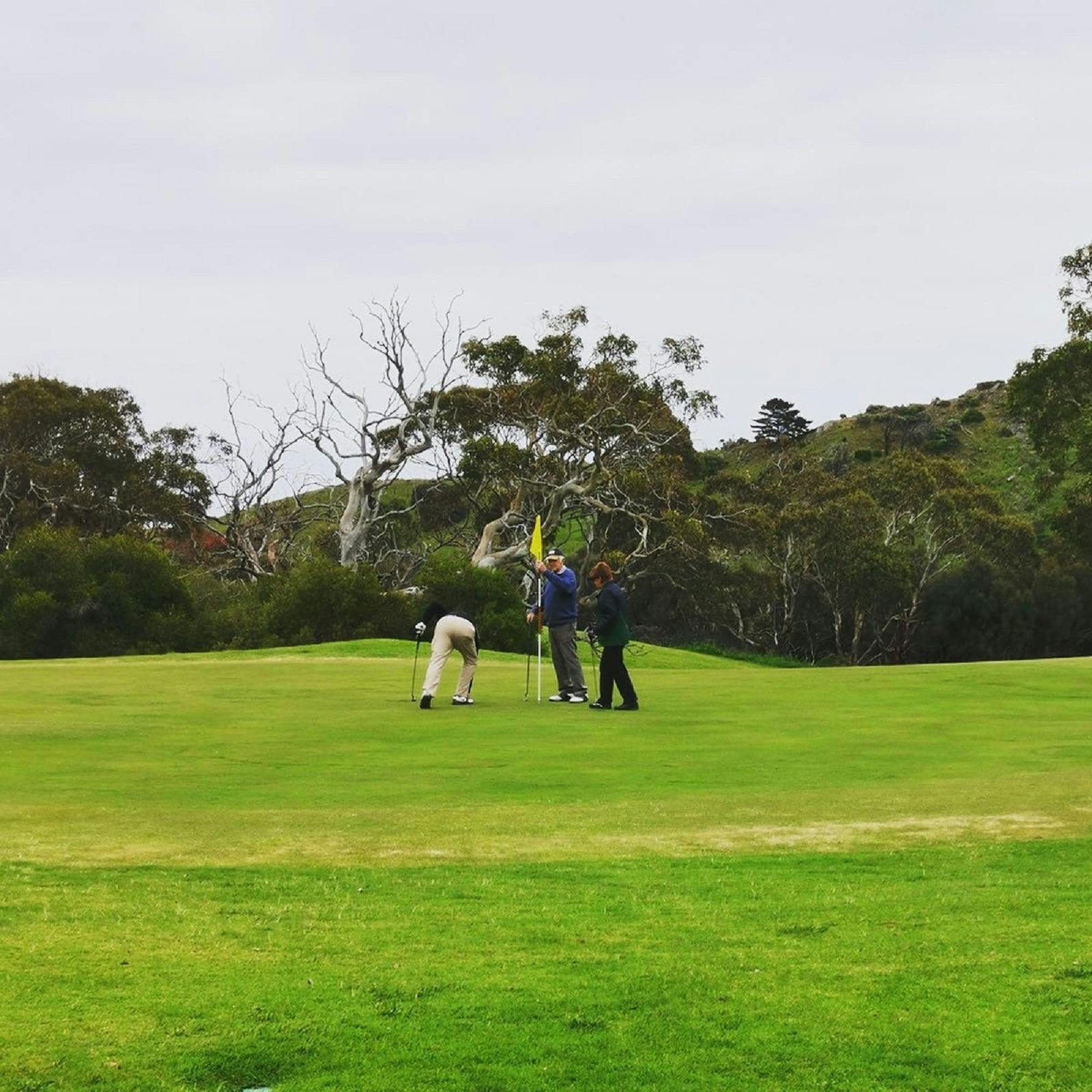 Putting out on 18 Green