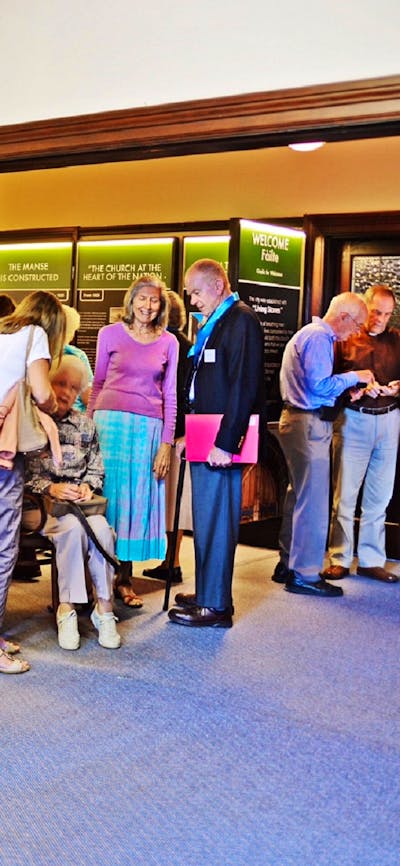 People viewing exhibition at inside the Church