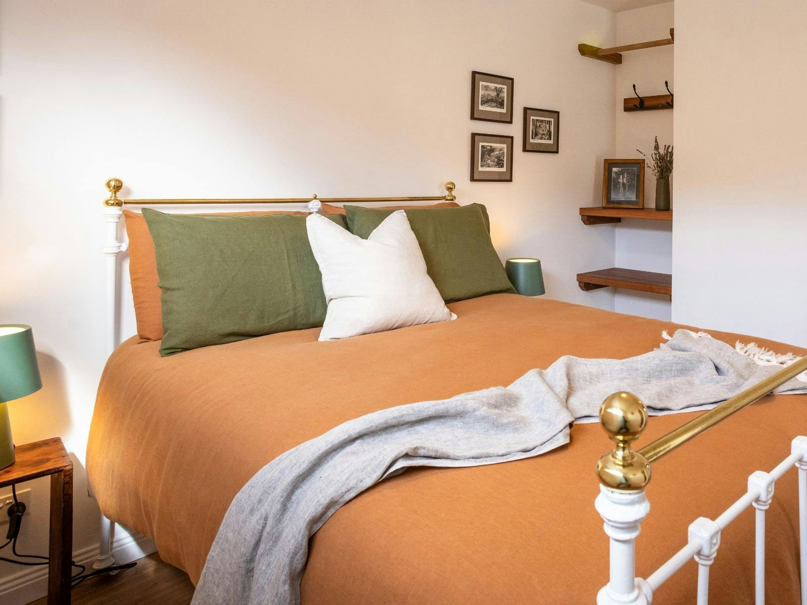 Cozy double bedroom featuring an ensuite bathroom.