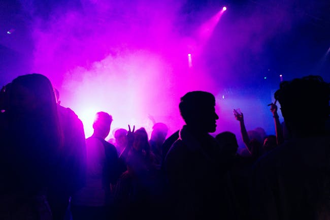 People dancing in a nightclub at night