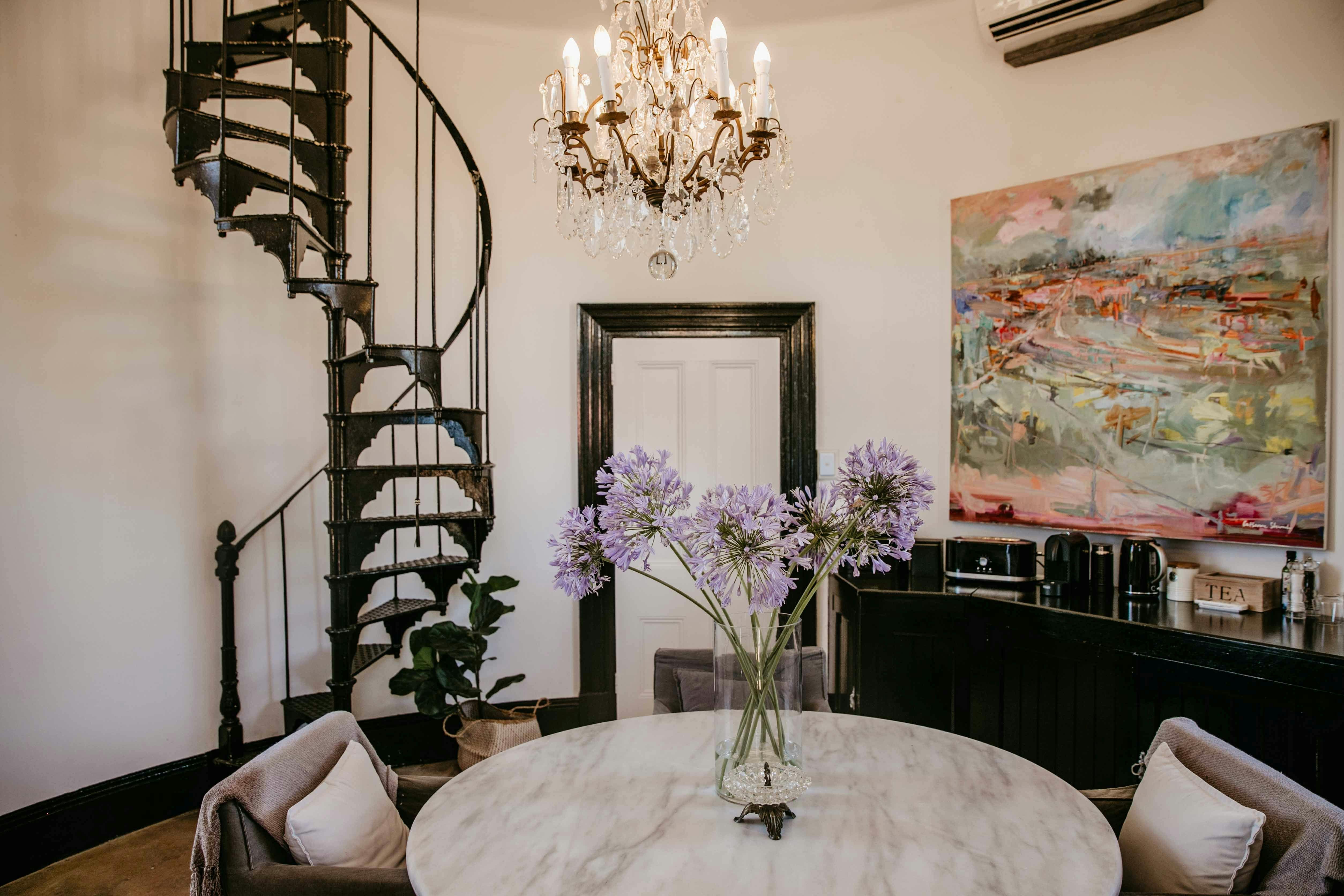 dining and kitchenette with spiral stairs in the background