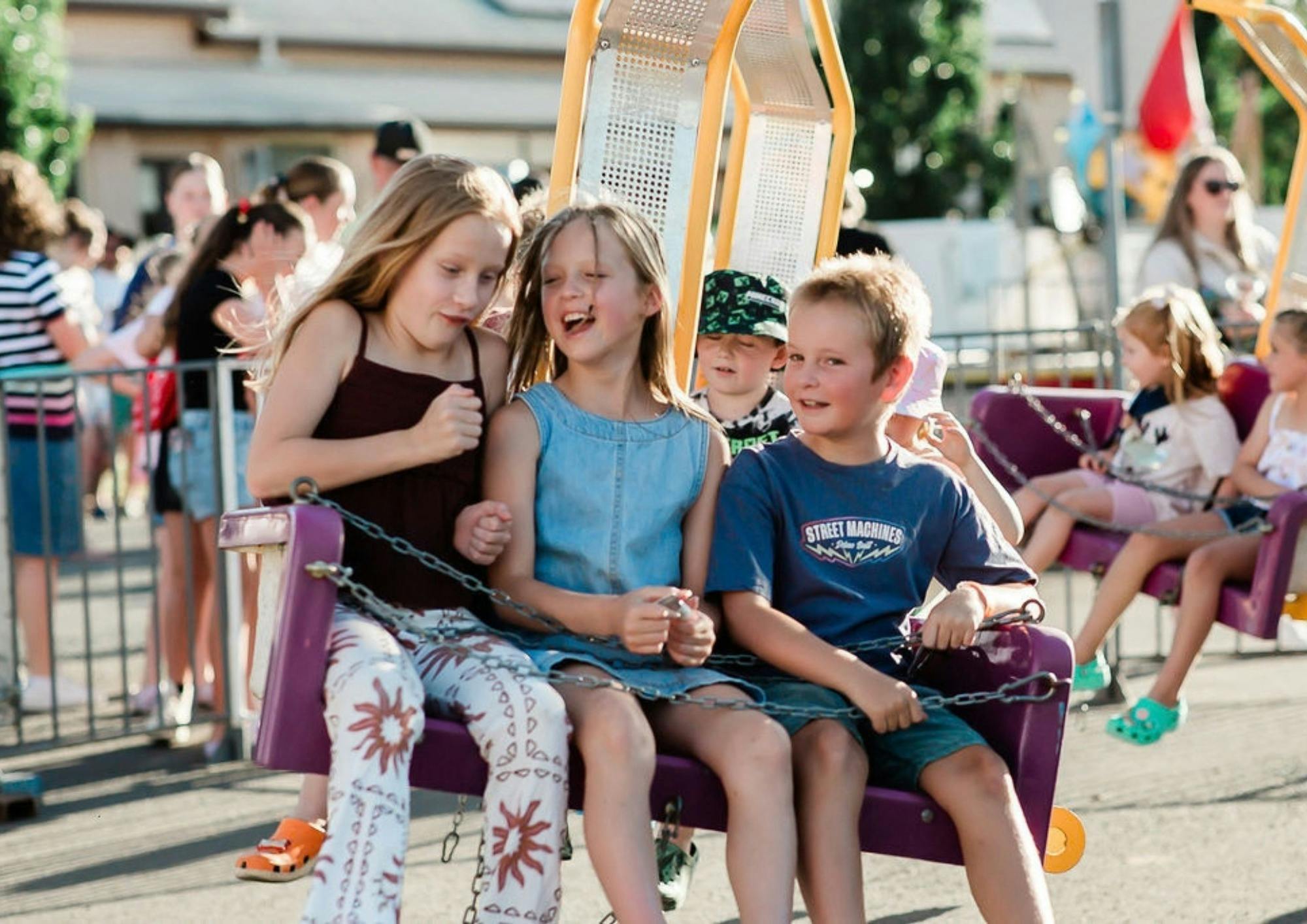 Children laughing on an amusement ride