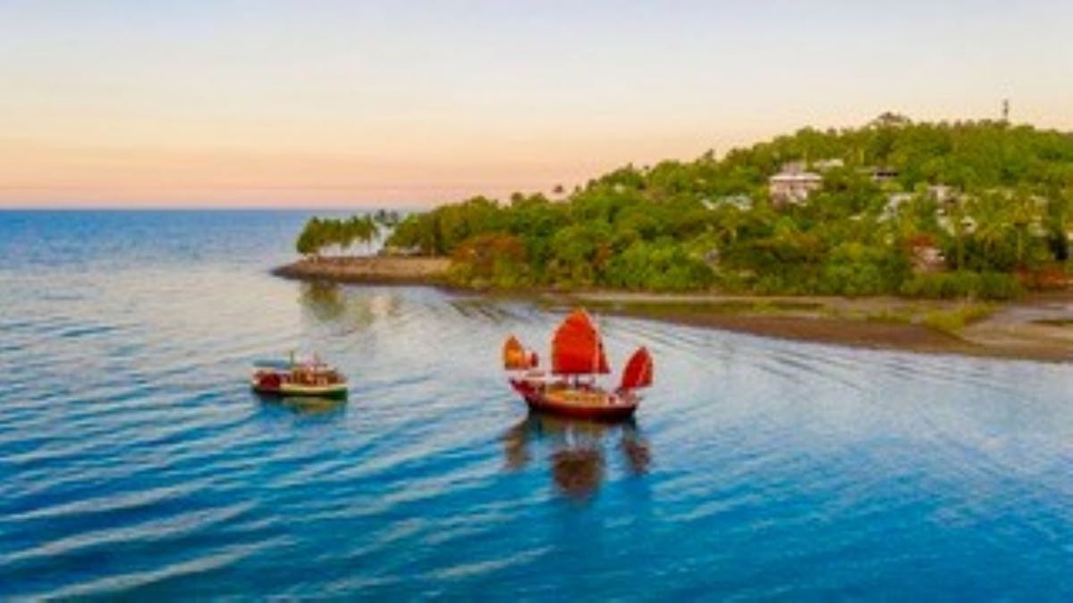 Sister boats Lady Douglas and Shaolin cruising back into Port Douglas, enjoying a spectacular sunset