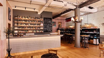 Bar with shelf full of different wines