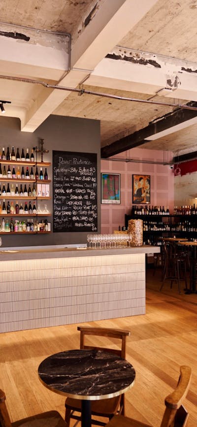 Bar with shelf full of different wines