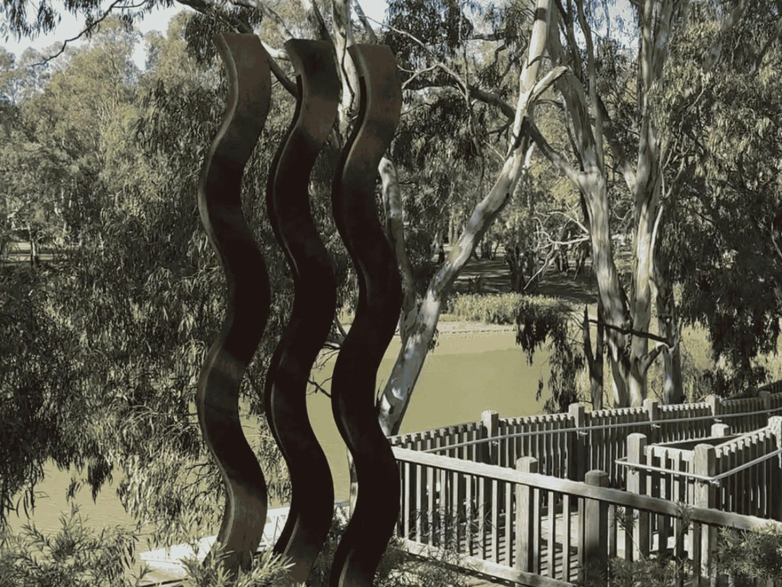 A rusted metal sculpture stands in the bush