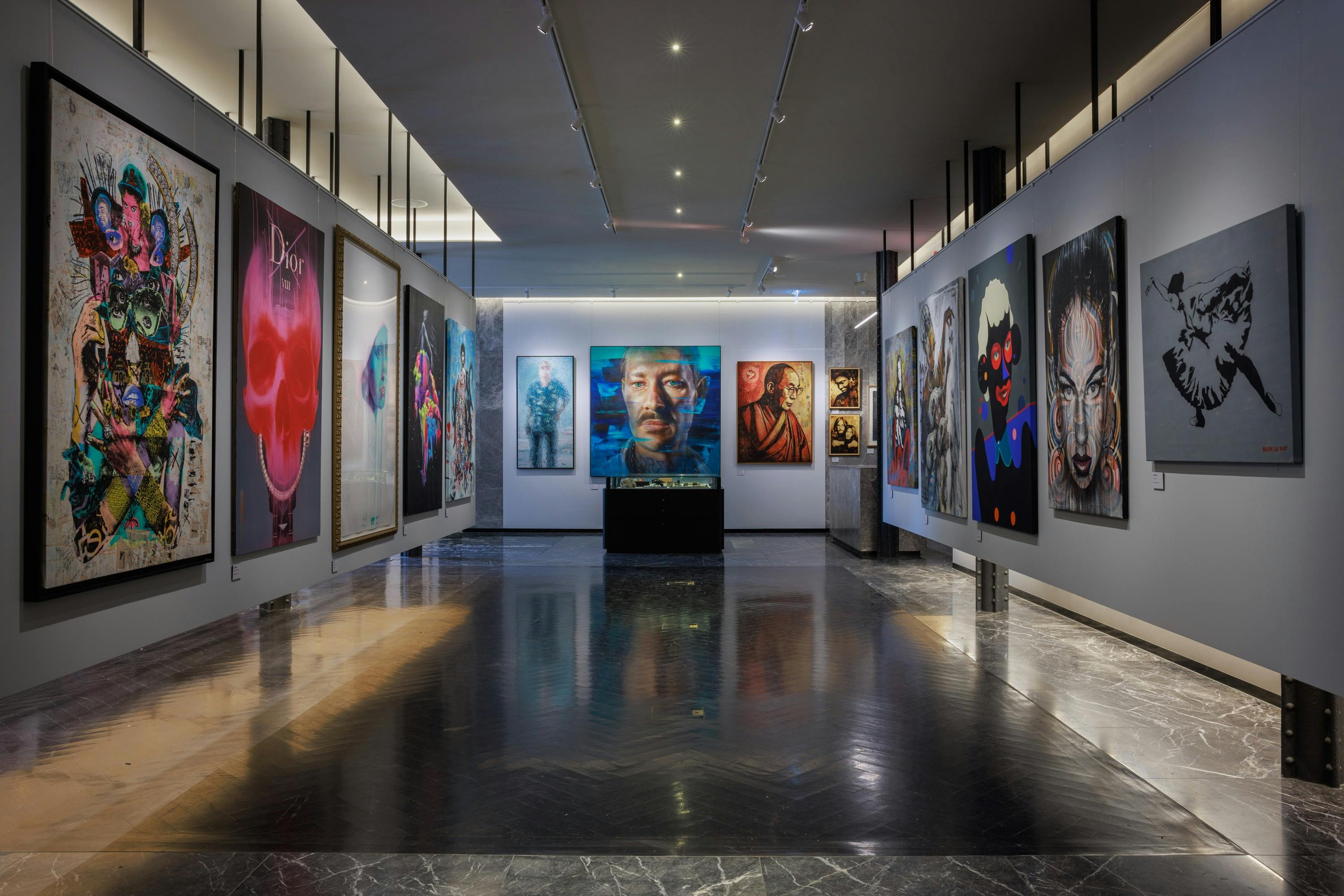 Street art paintings hung on a wall