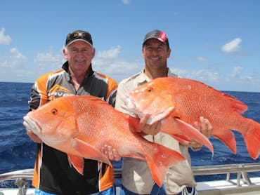 Men with red fish