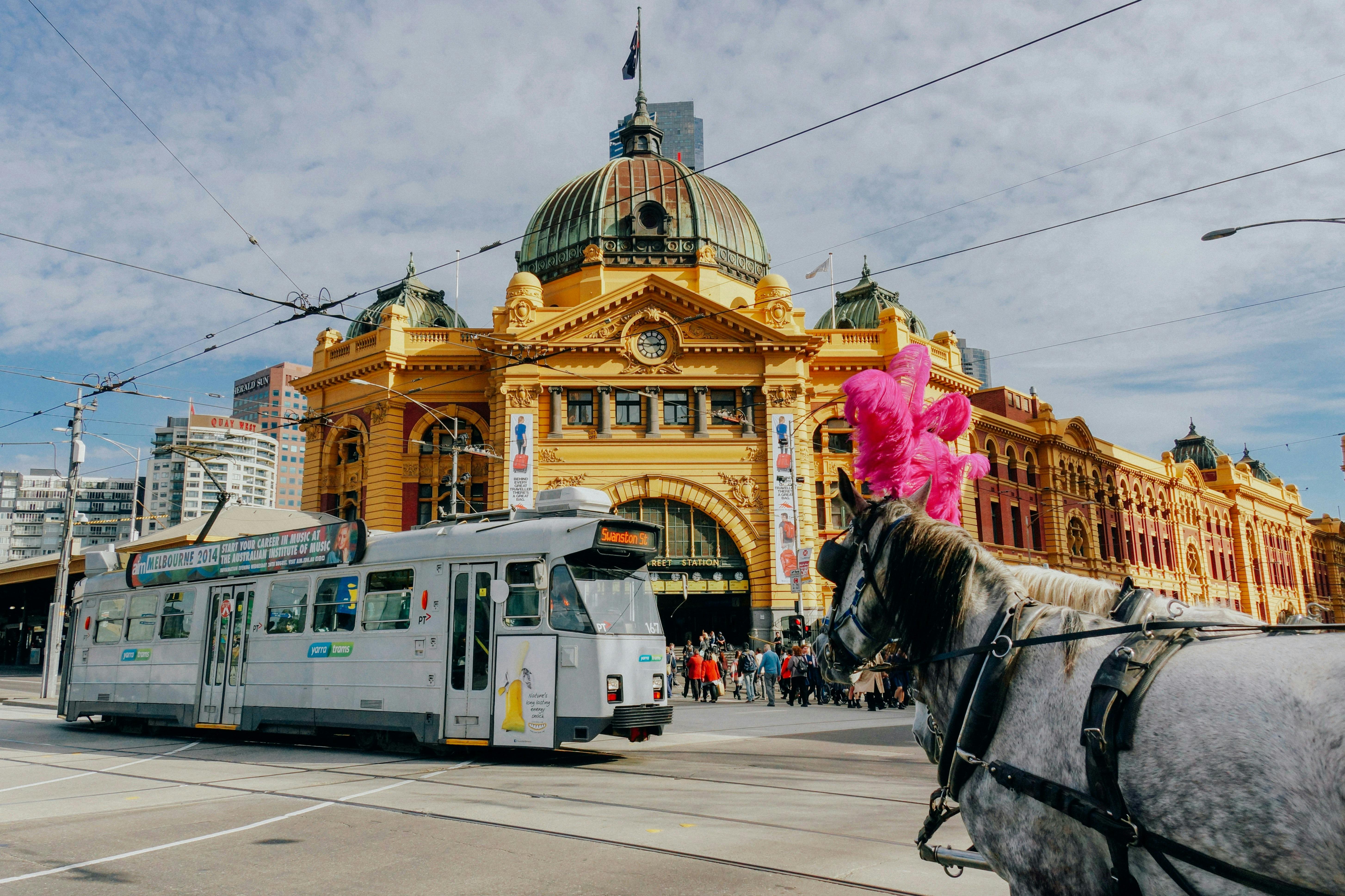 The image shows the iconic Flinders Street Station in Melbourne, Australia.