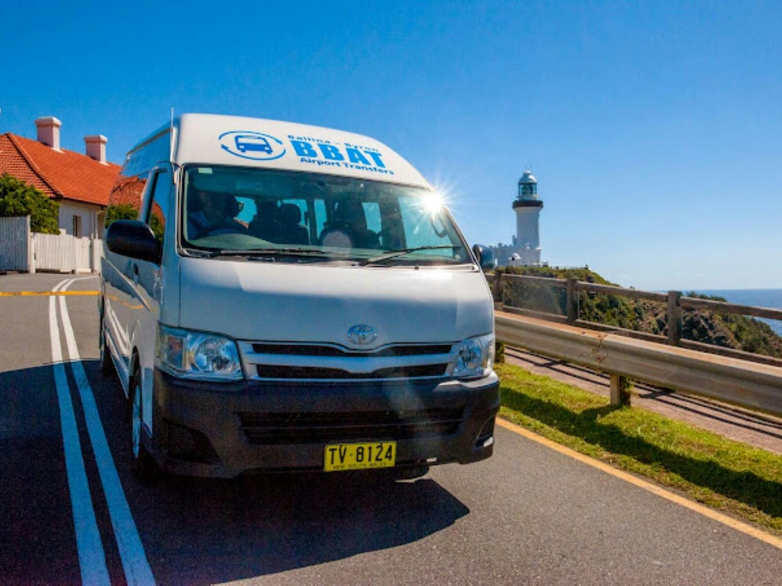 Van with Byron Lighthouse in background