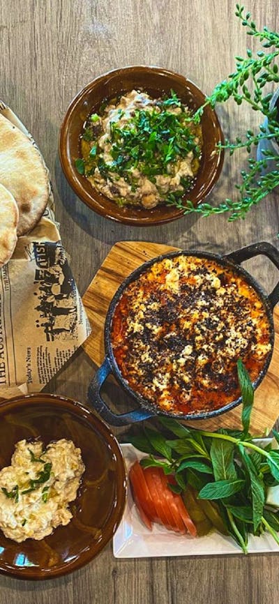 Spread of Lebanese food on wooden table