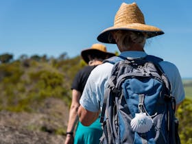 Aussie Camino pilgrim with shell on backpack