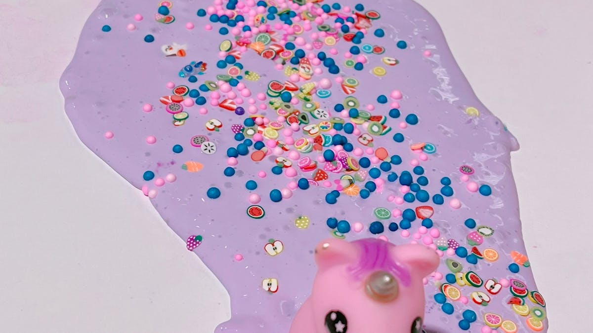 Purpler thick and glossy slime with colorful toppings and charms