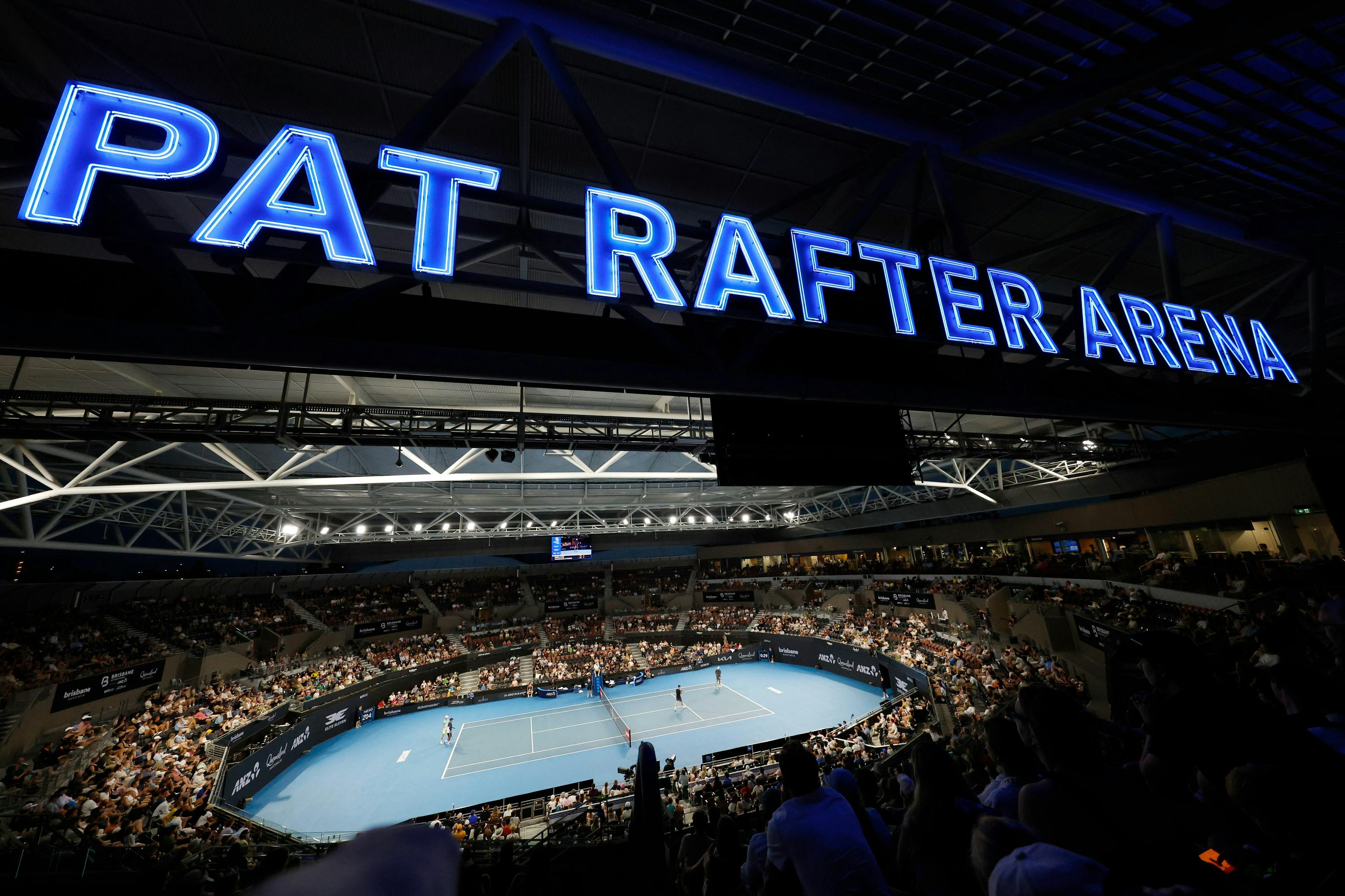 Illuminated blue Pat Rafter Arena signage above the court