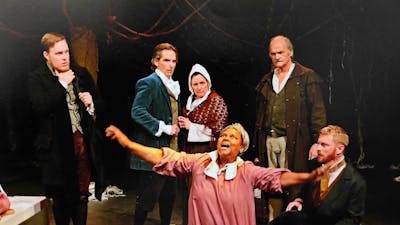 a young woman in pink dress is on her knees as 5 others in 1690s period costume look on in fear