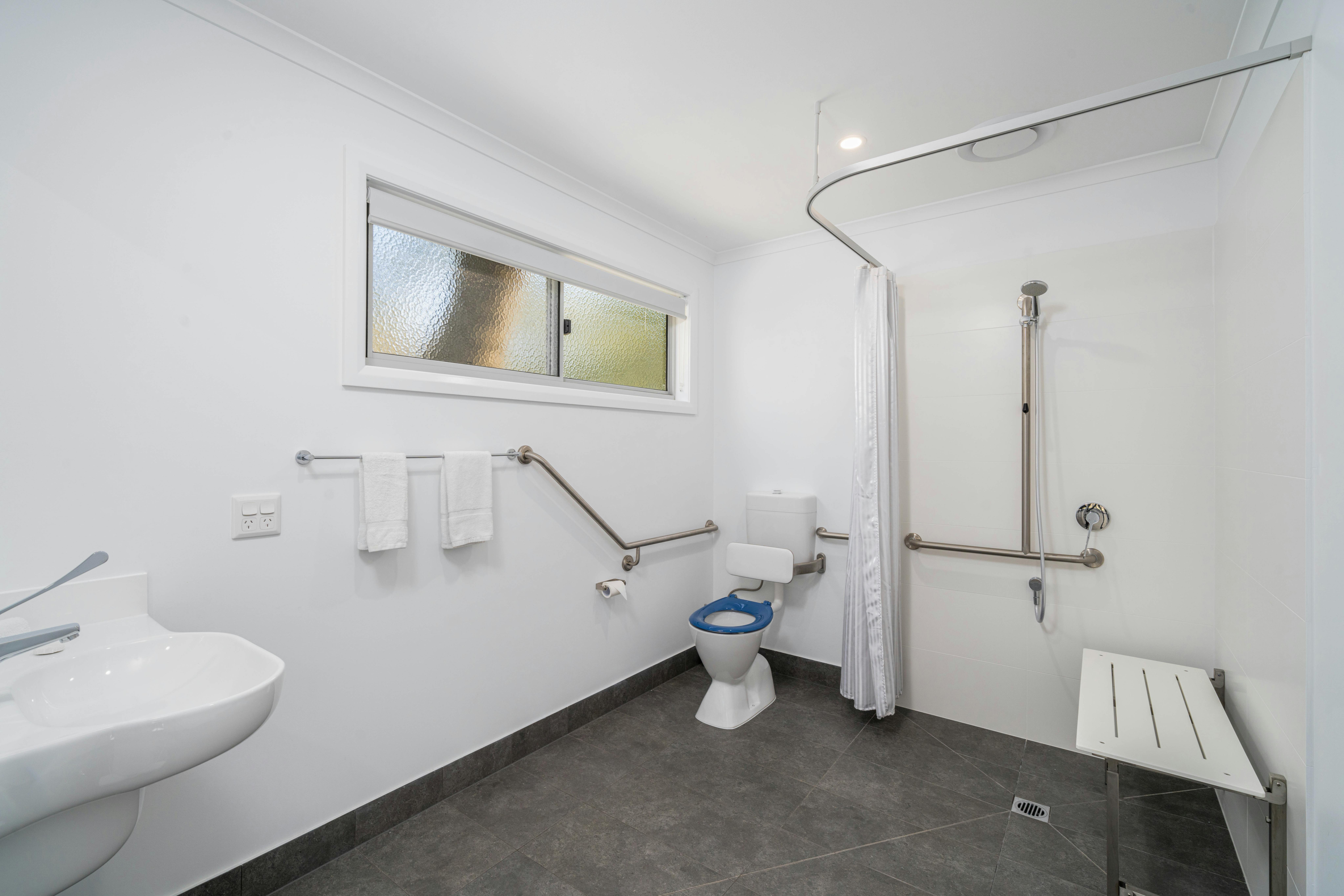 Premium family cabin showing large wheel chair friendly and accessible bathroom