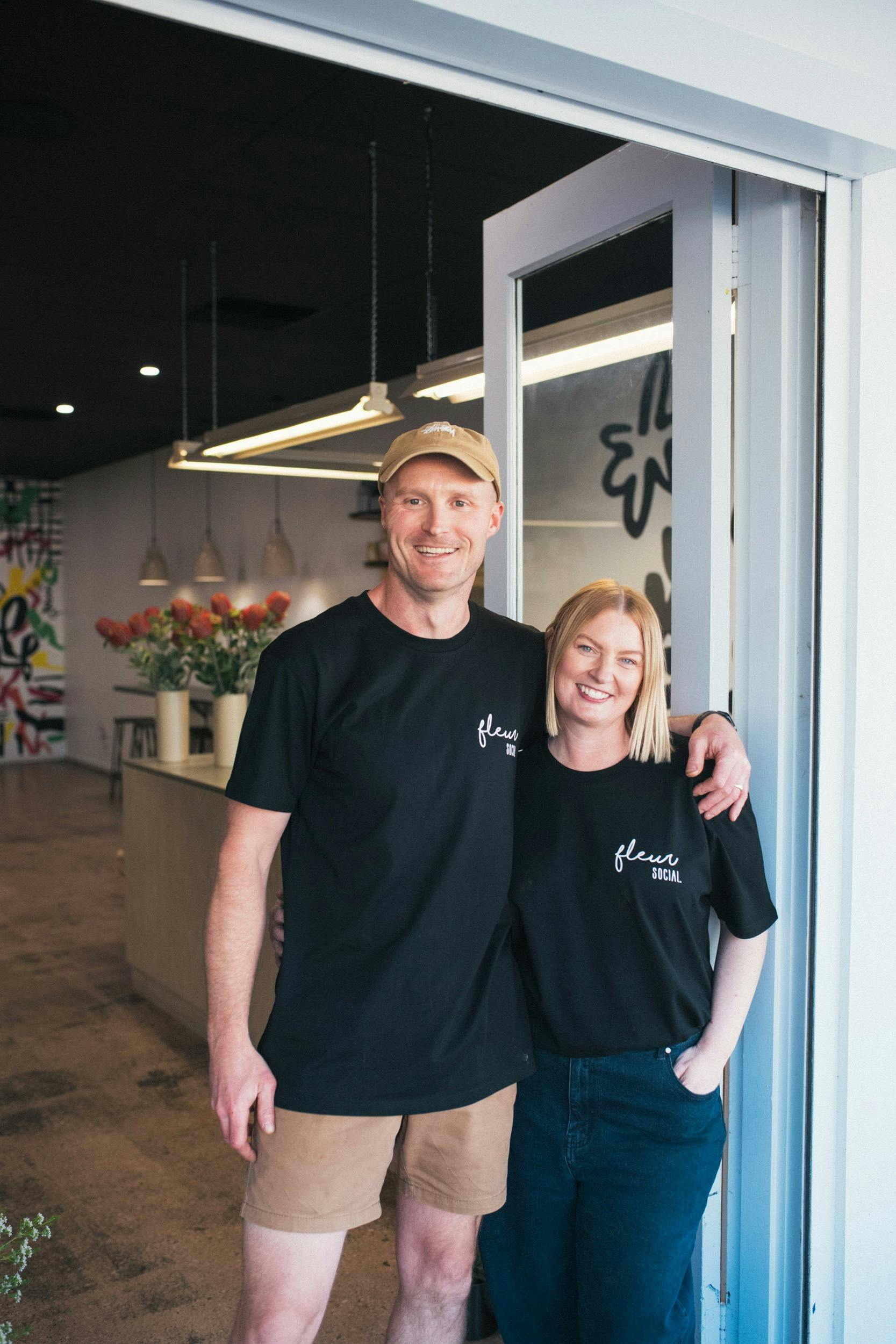 Fleur Social entrance with owners Sara and Ryan