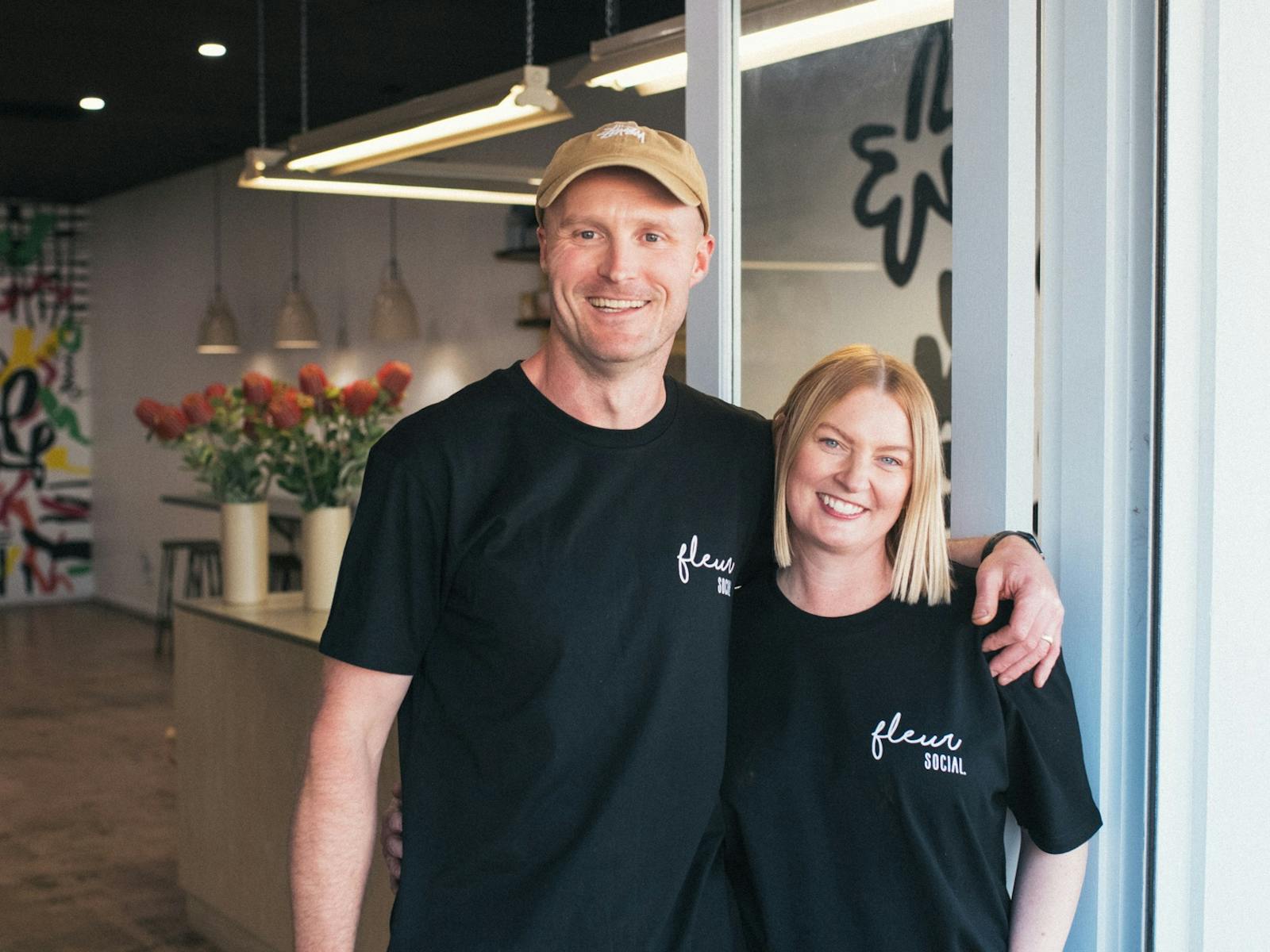 Fleur Social entrance with owners Sara and Ryan