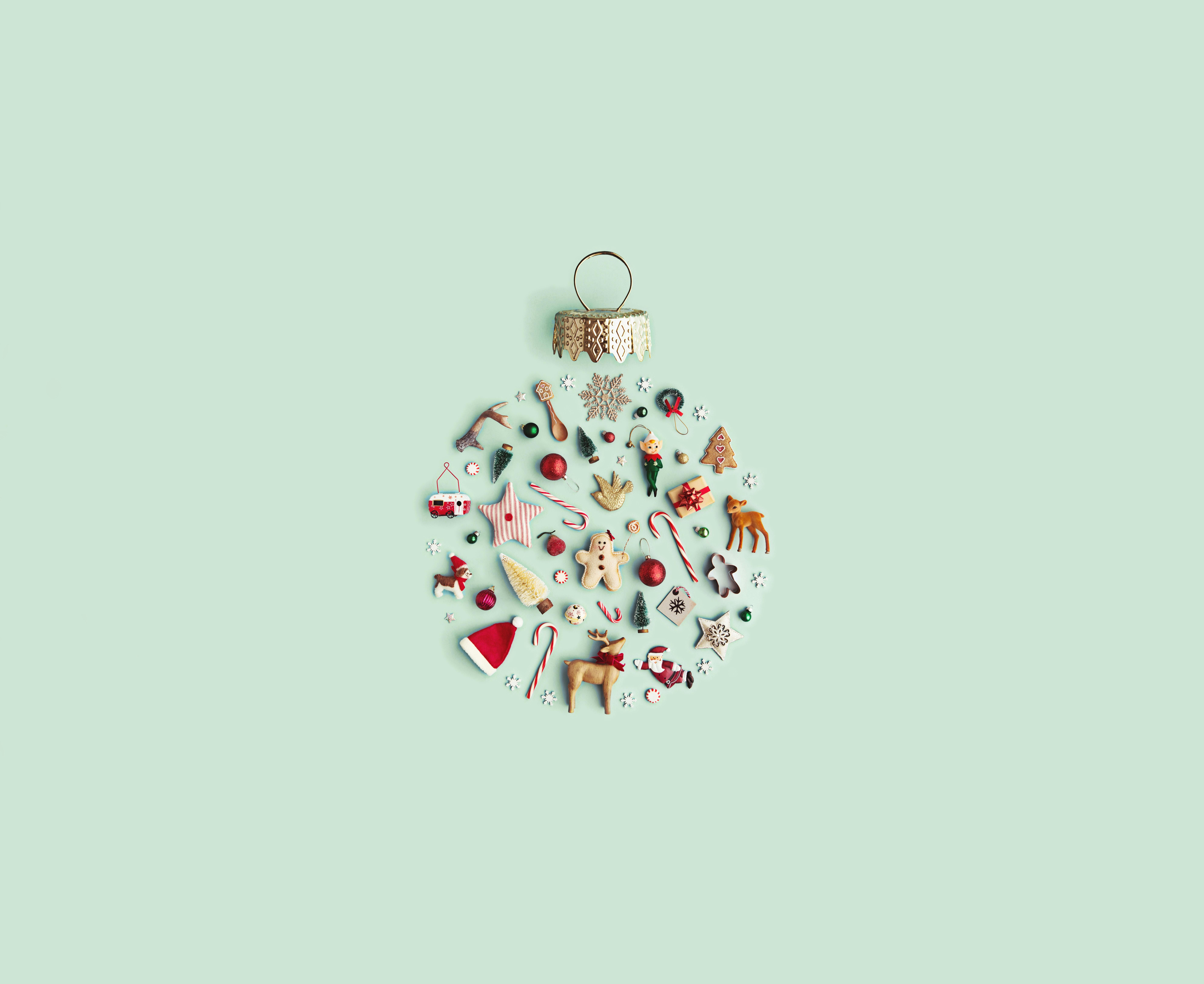 An artwork of Christmas ornaments arranged in the shape of a Christmas bauble