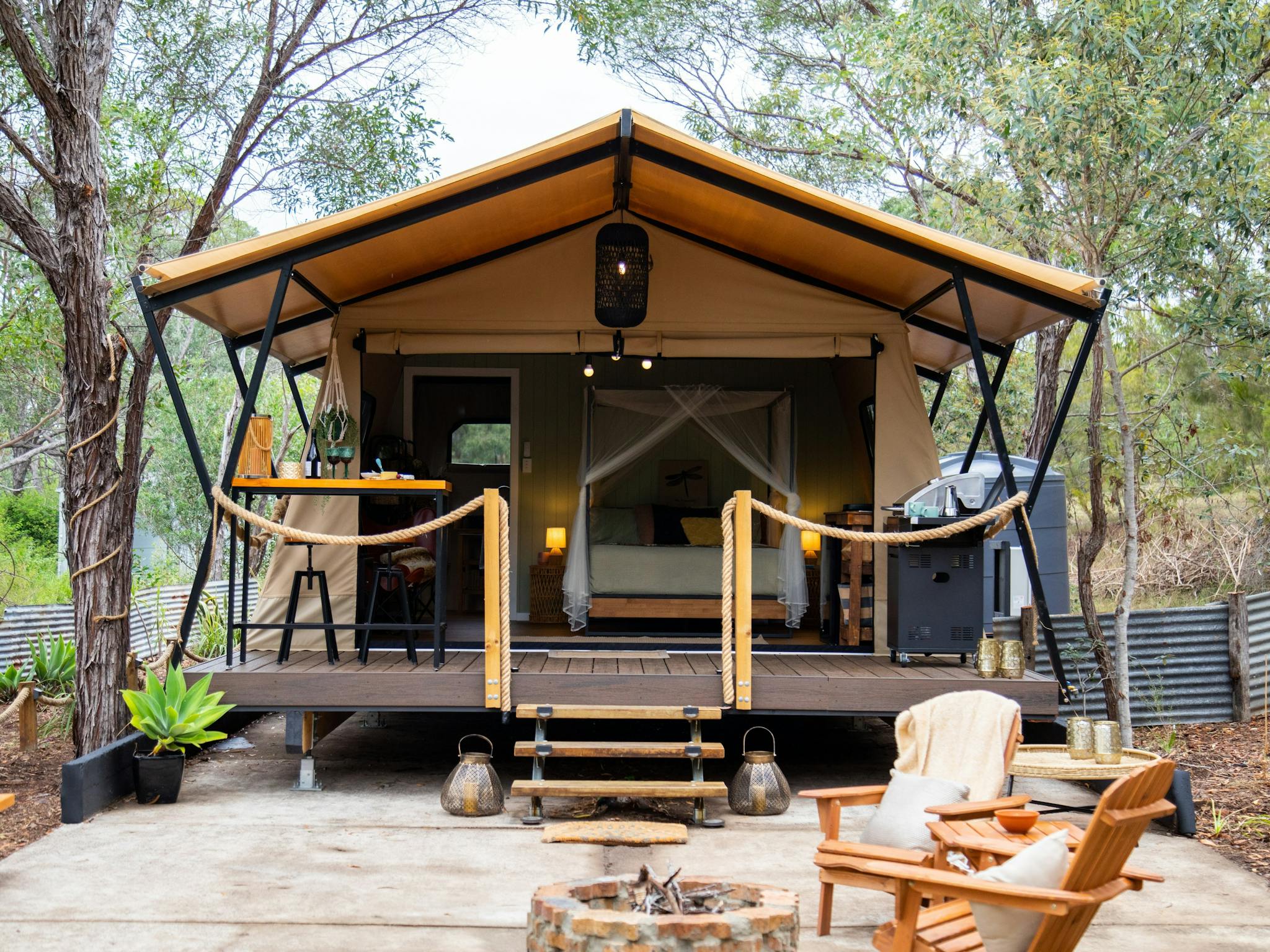 external view of safari tent in a bush setting with trees around external view of safari tent in a bush setting with trees around