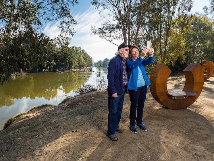 Couple taking a selfie at Oura Beach Reserve near Wagga Wagga