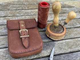 Leather pouch with brushes