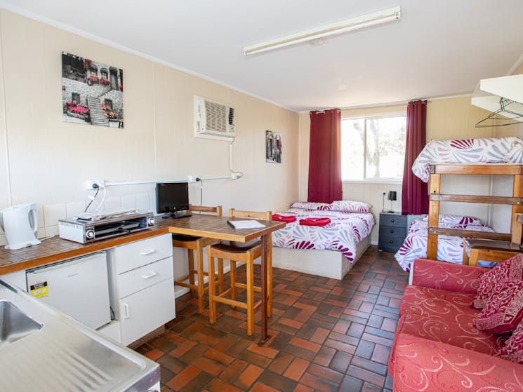 Double bed plus double bunks. Kitchenette with enough equipment to cook basic meals.