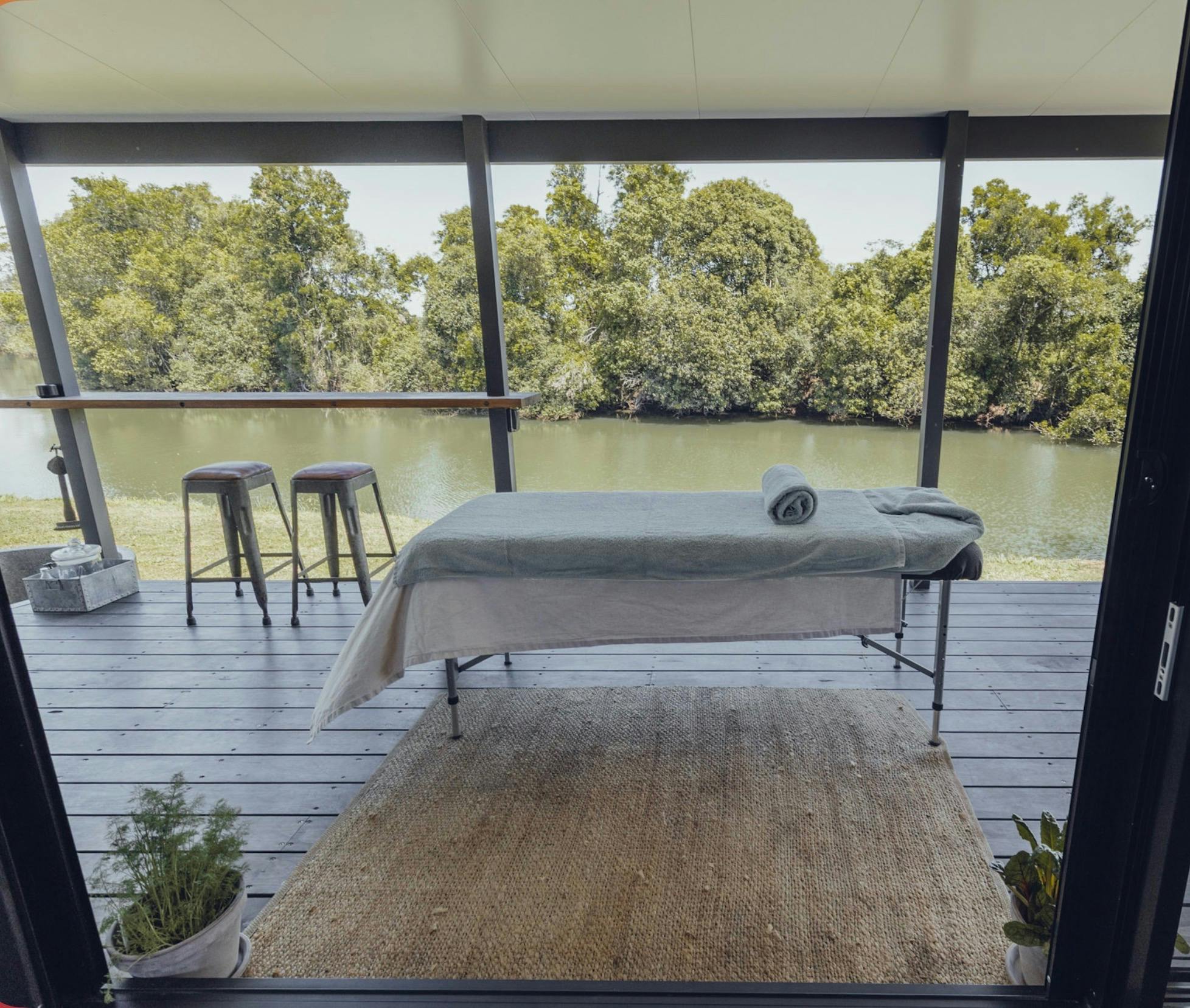 Massage on the tiny house deck by the River