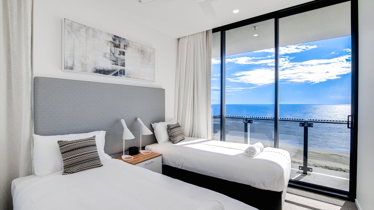 The second bedroom in a 3 bedroom oceanfront apartment. Beautiful views of the ocean and beach