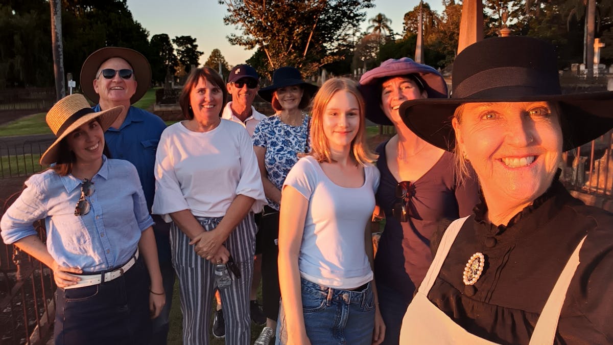 A smiling group pf people in the Drayton and Toowoomba Cemetery