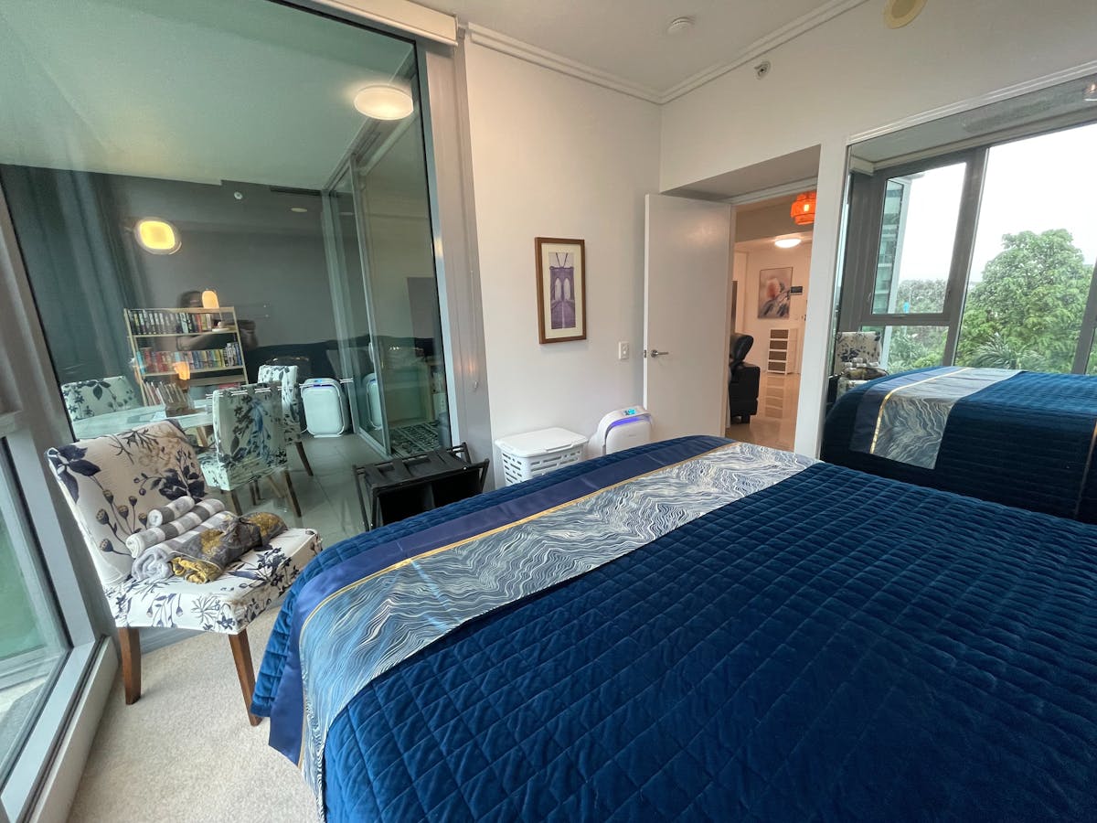 Views of the balcony, city and river can be seen from the master suite