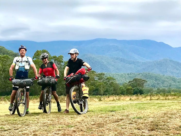 Three bike-packing cyclists out on track