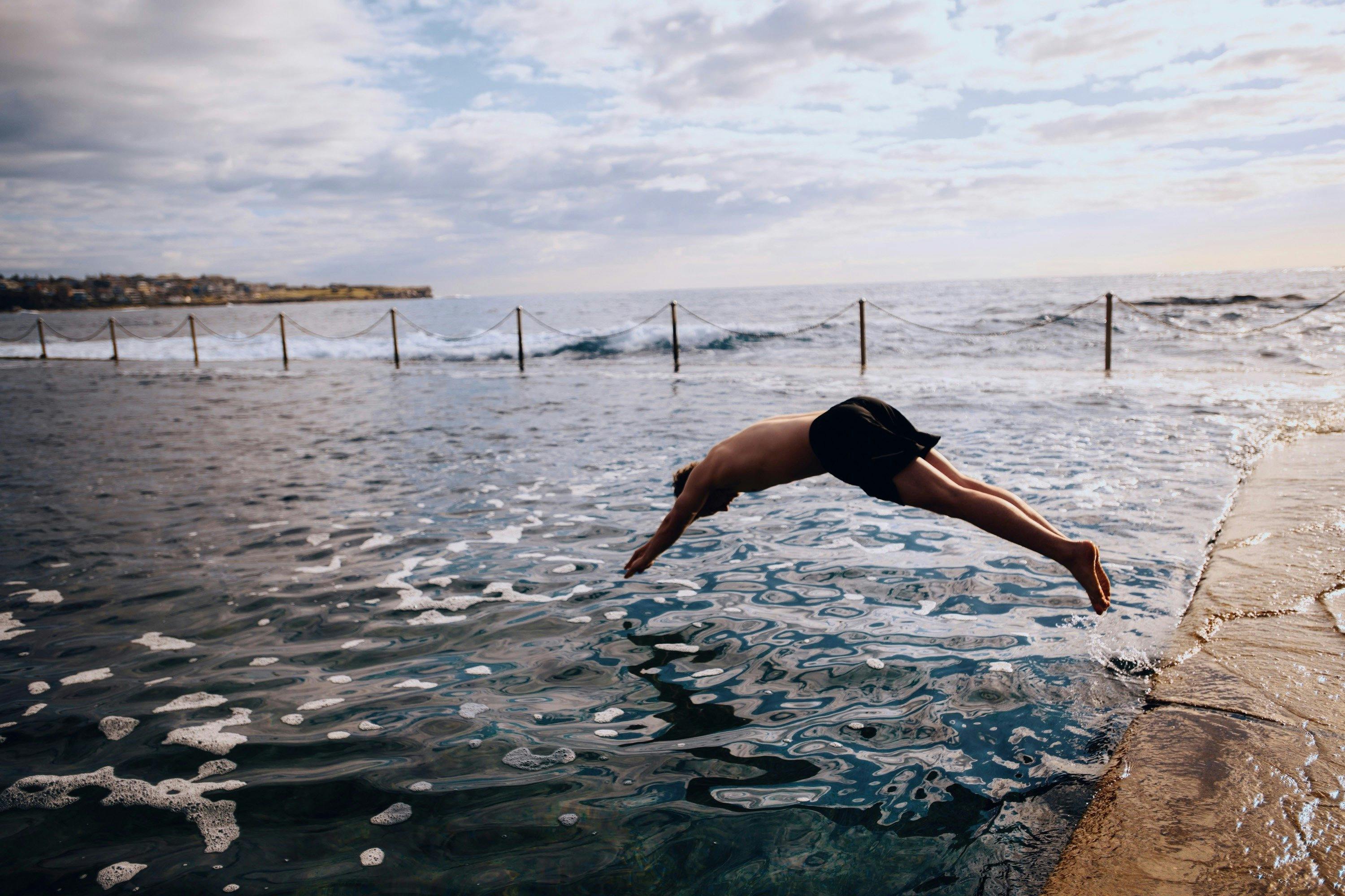 Man enjoying a morning swim at Wylies Baths, Coogee