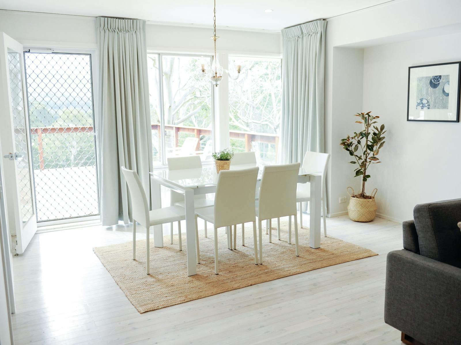 Dining area with seating for 6 guests and access to deck