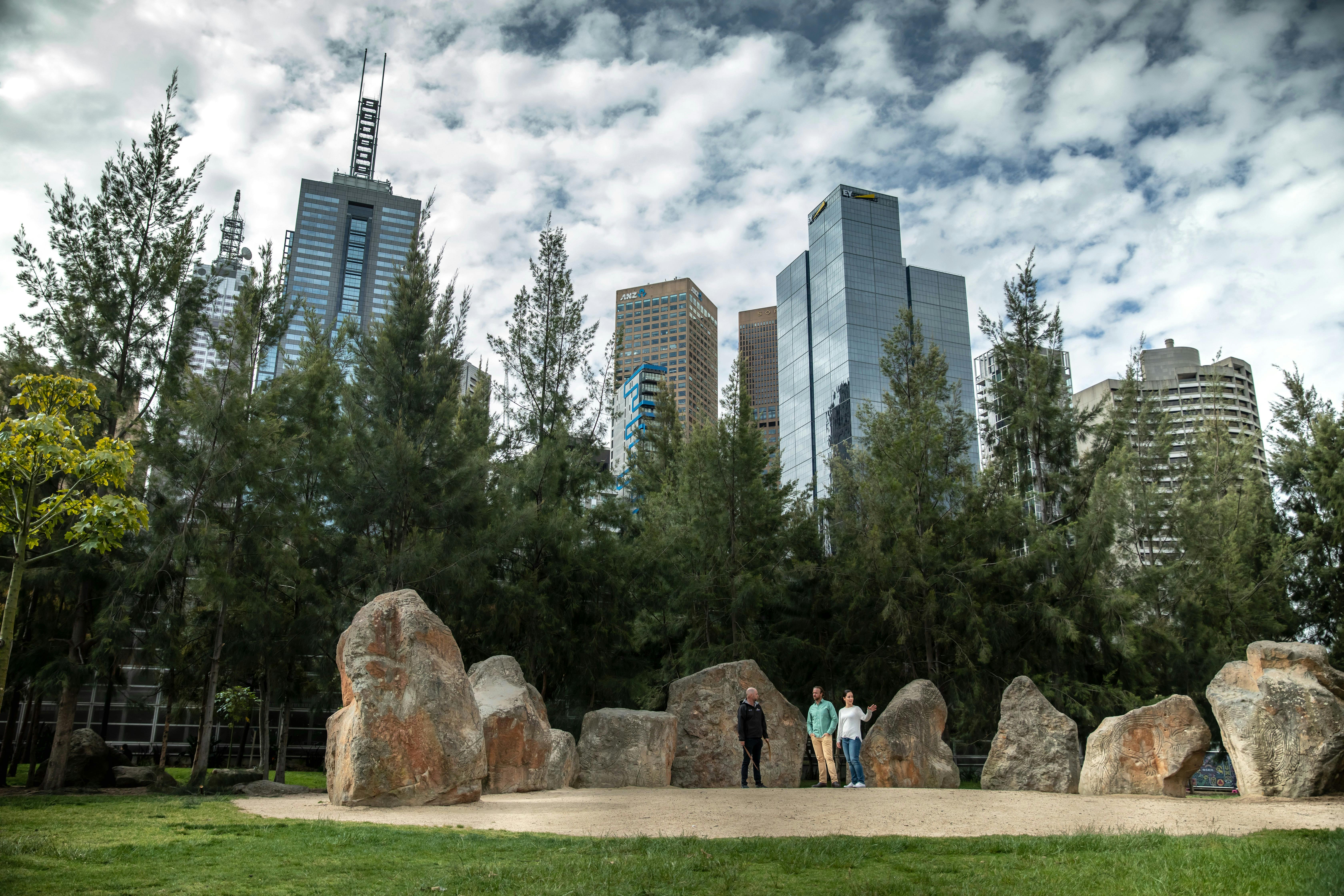 People looking at rock art in the city.