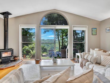Open plan living room area with indoor fireplace Open plan living room area with indoor fireplace
