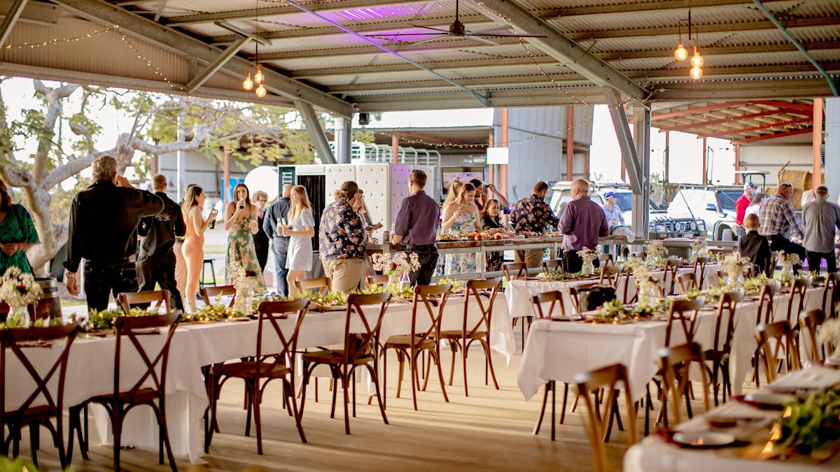 People standing at a wedding reception at Note Park Grazing Co.