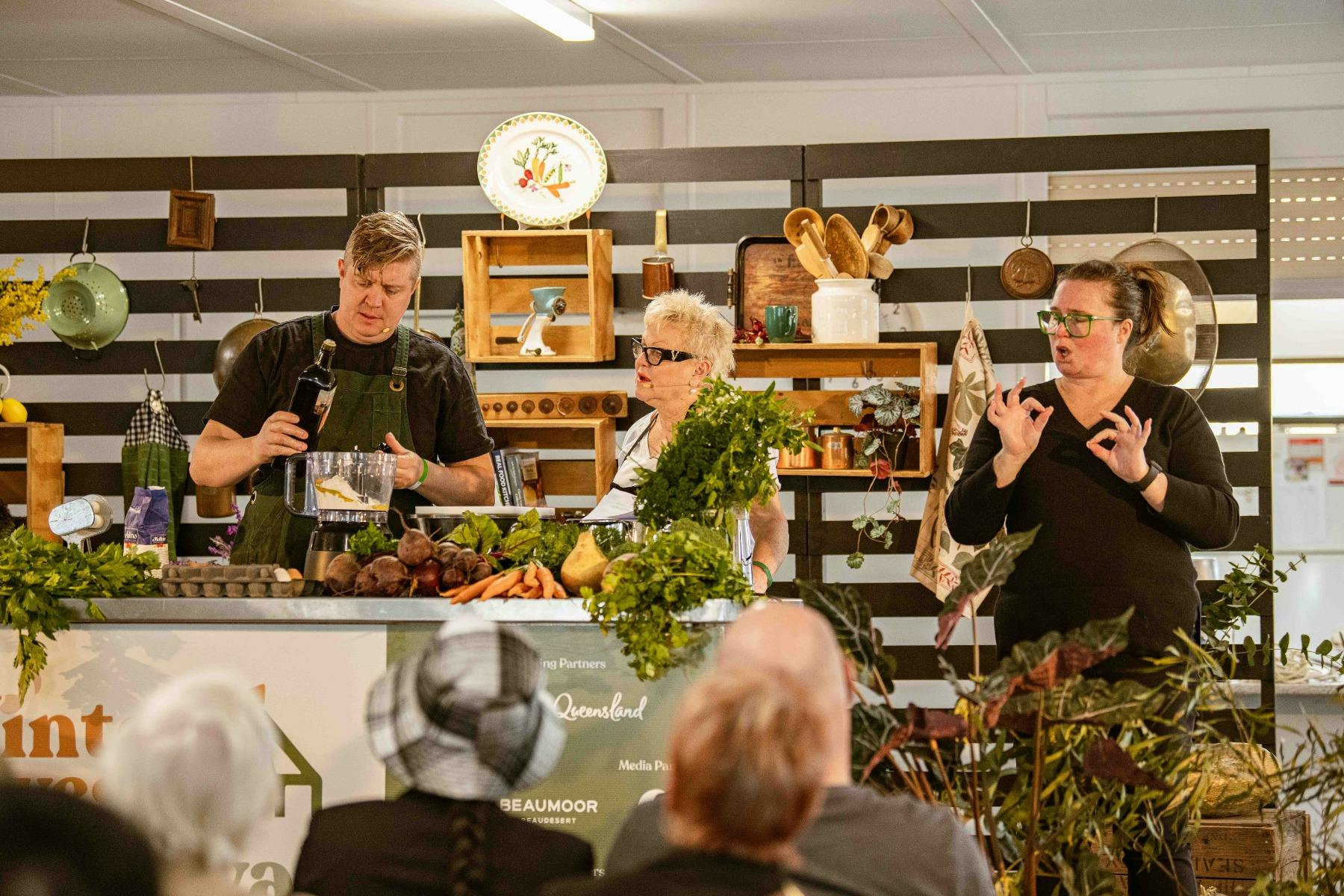 Cooking demonstration with two chefs and an Auslan interpreter