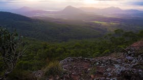 View over flats, mountains and valleys on cloudy day.