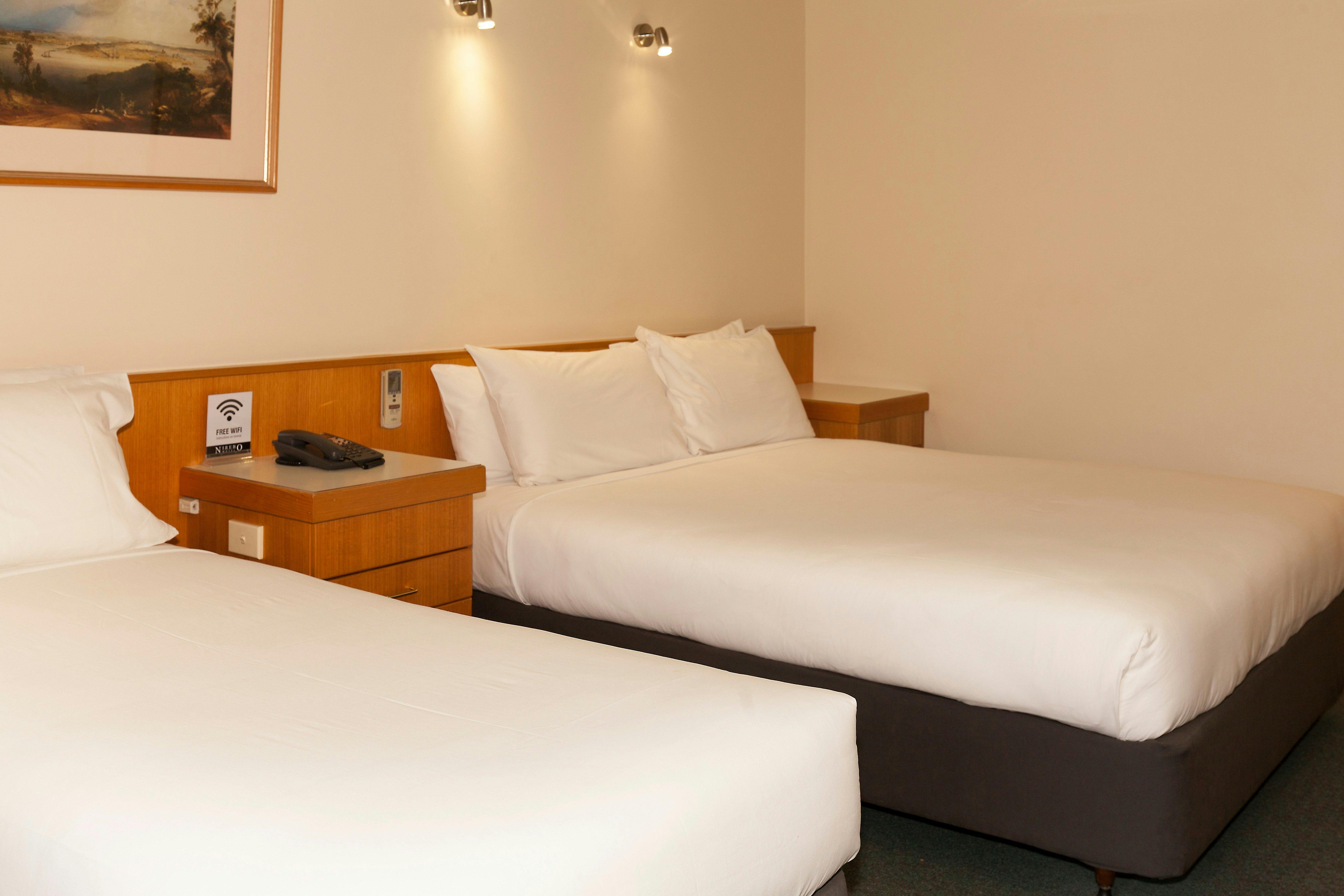 Queen bed plus single with free wifi, tea coffee making facilities and LCD TV.