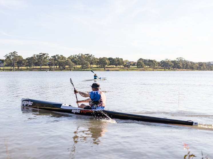 Two kayakers on the waters of Lake Albert