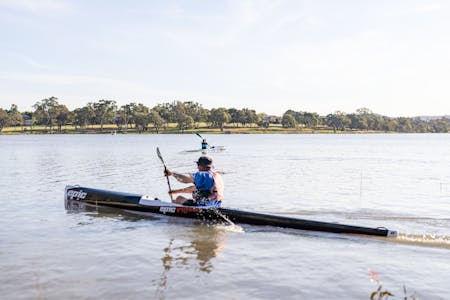 Two kayakers on the waters of Lake Albert