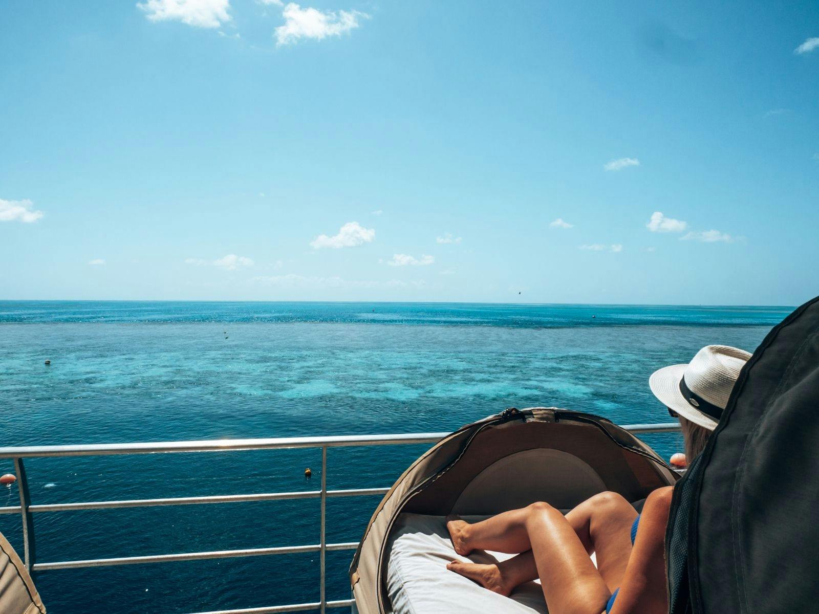 A guest on a Reefbed looking over the Great Barrier Reef