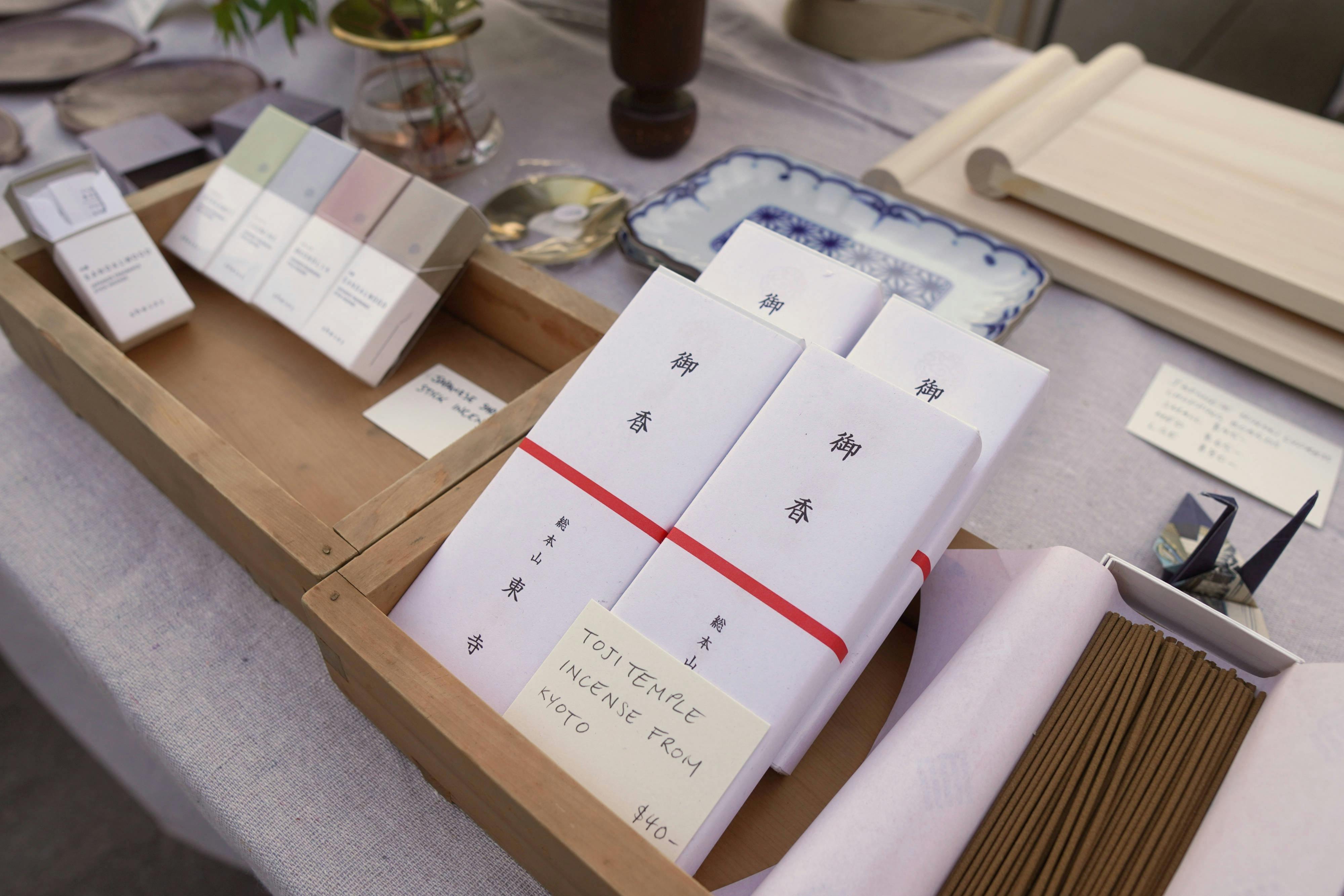 Photo of incense boxes in wooden boxes on a table