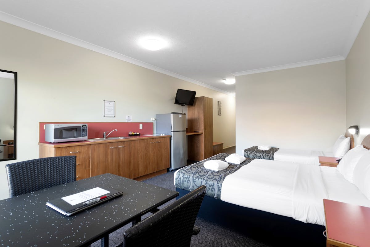 Twin Self-Contained Unit features a kitchenette and furnished balcony.